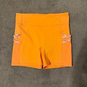 Fabletics Trinity Motion365 Mid-Rise Pocket 5” Inseam Vibrant Orange Shorts
